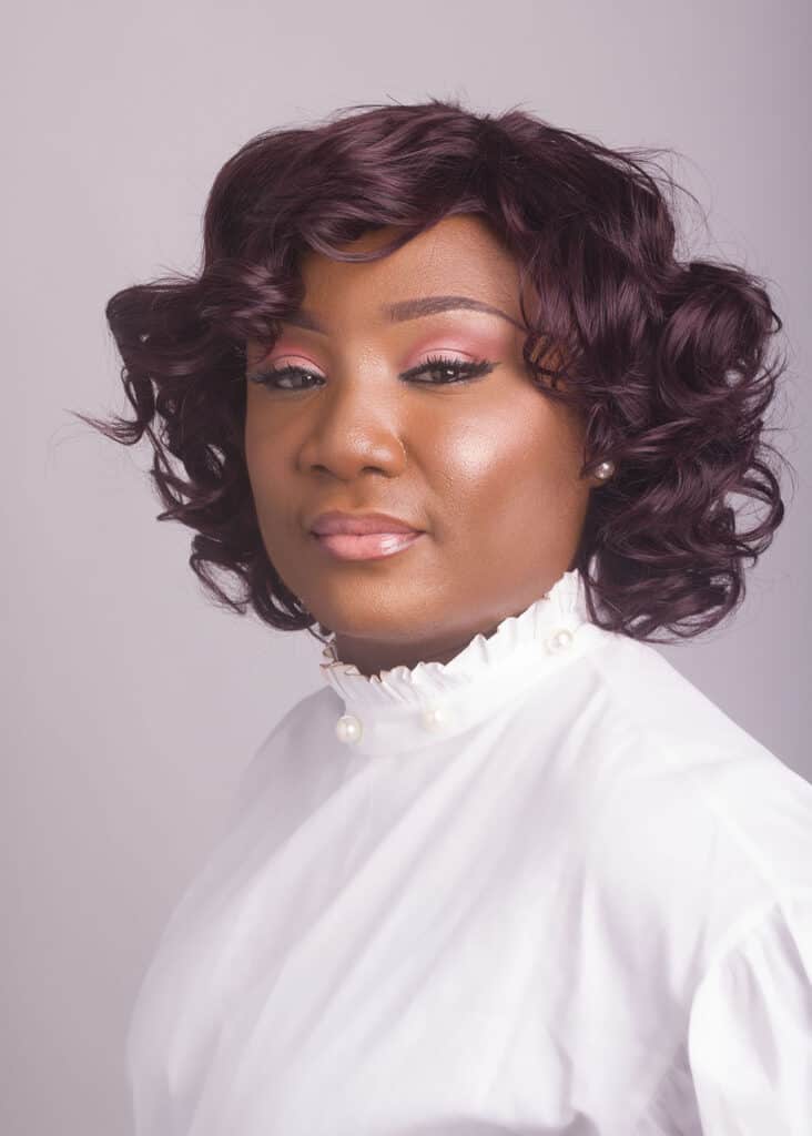 female in white corporate headshot