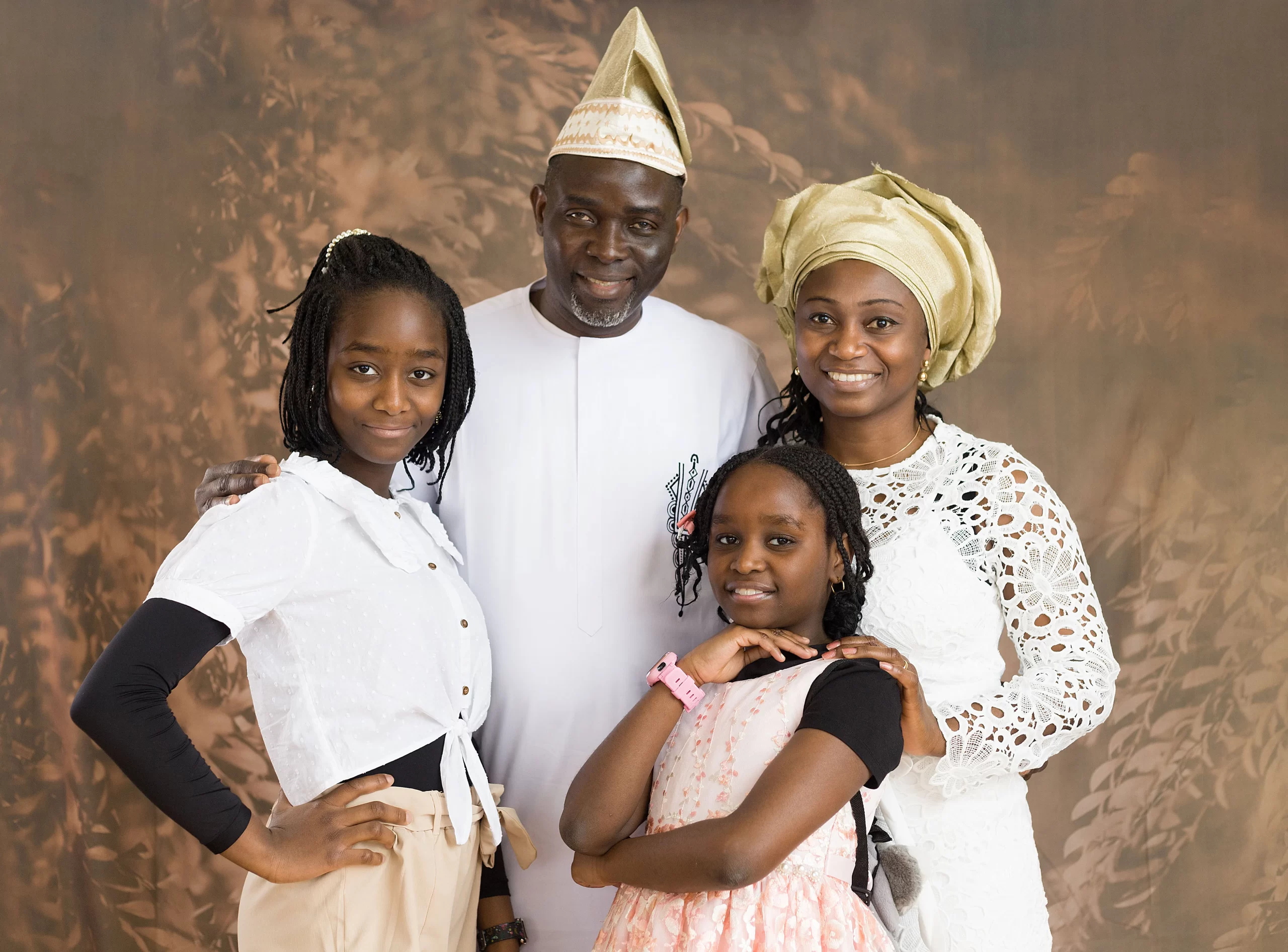 a nigerian family with a husband, wife and 2 girls
